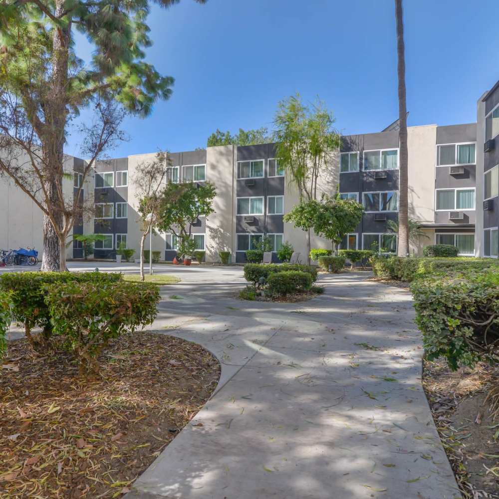 Exterior view of apartment with walkway at Reseda Park in Reseda, California