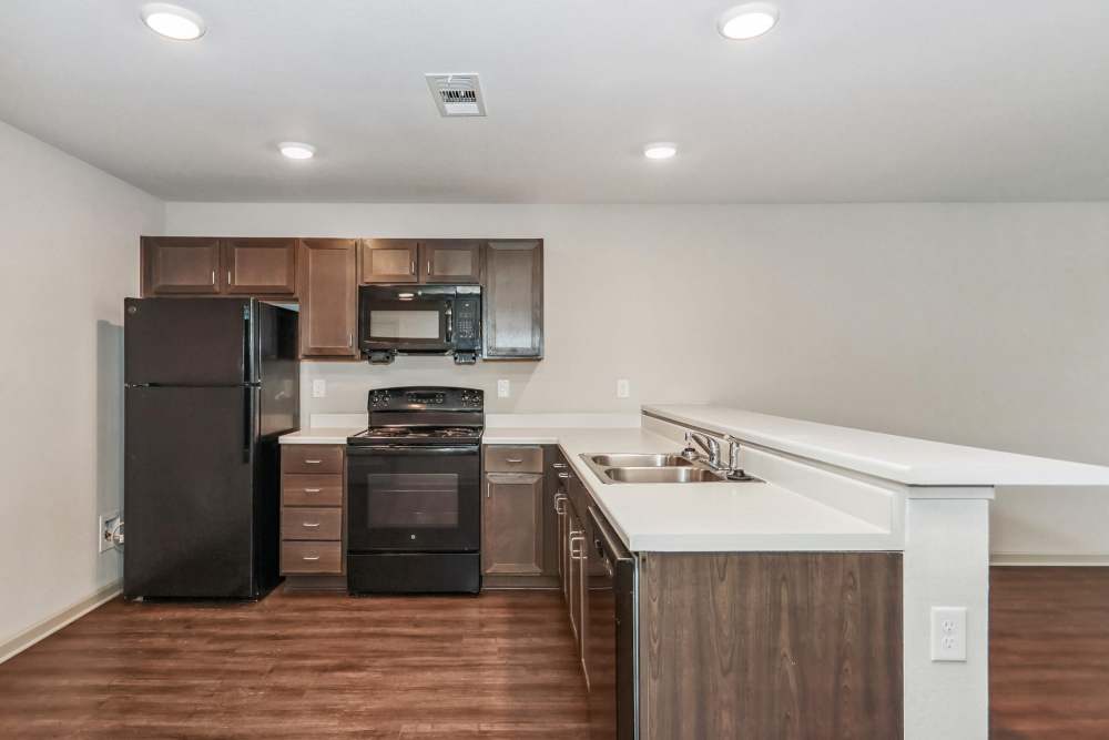 A view of kitchen room with bar counter at Flats at Mount Zion in Stockbridge, Georgia