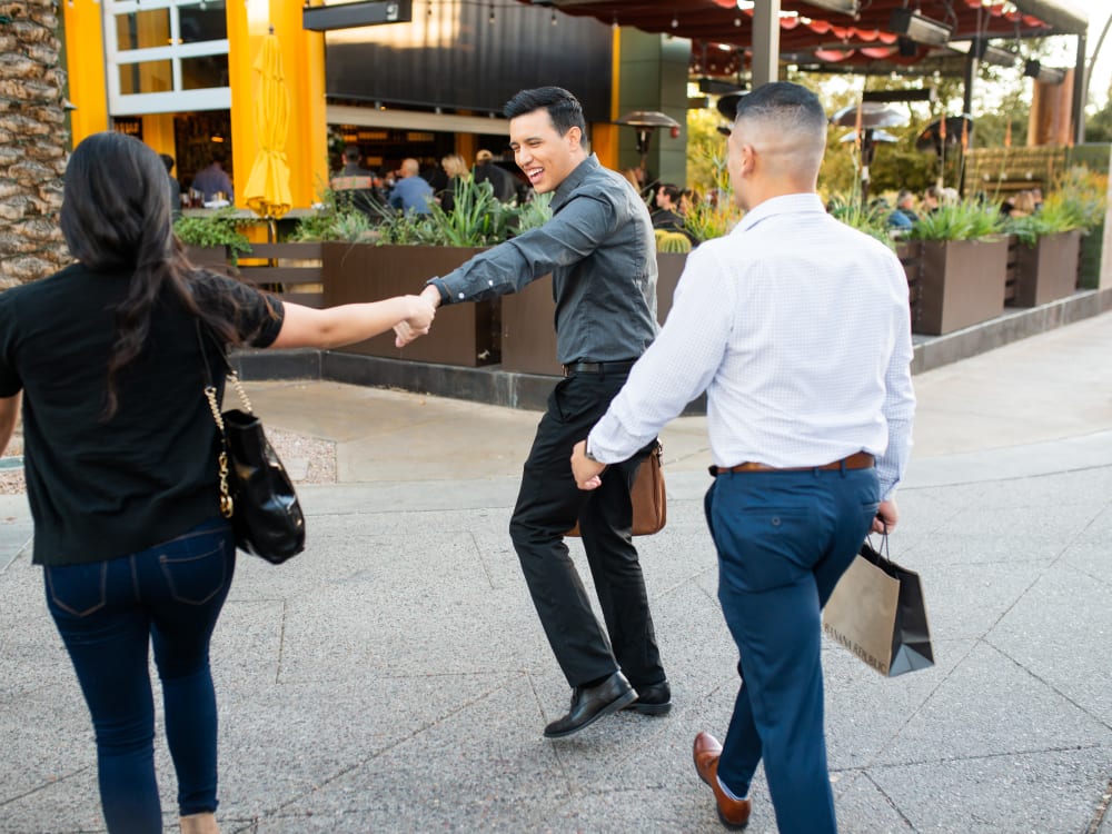 Resident walking downtown with a friend near San Capella in Tempe, Arizona