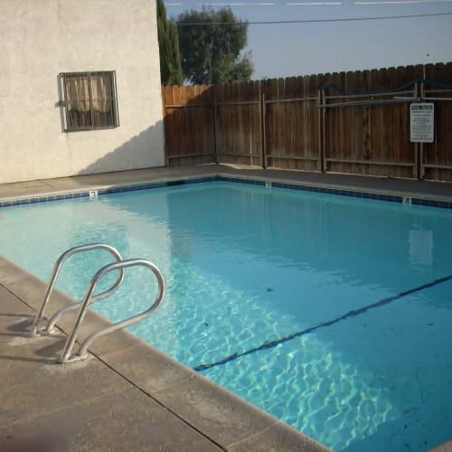 View of the swimming pool at El Potrero Apartments in Bakersfield, California