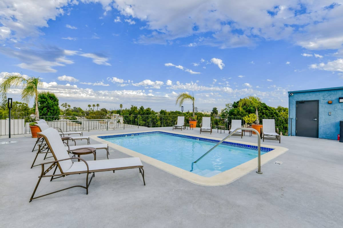 Pool with lounge chairs at Villa Esther, West Hollywood, California