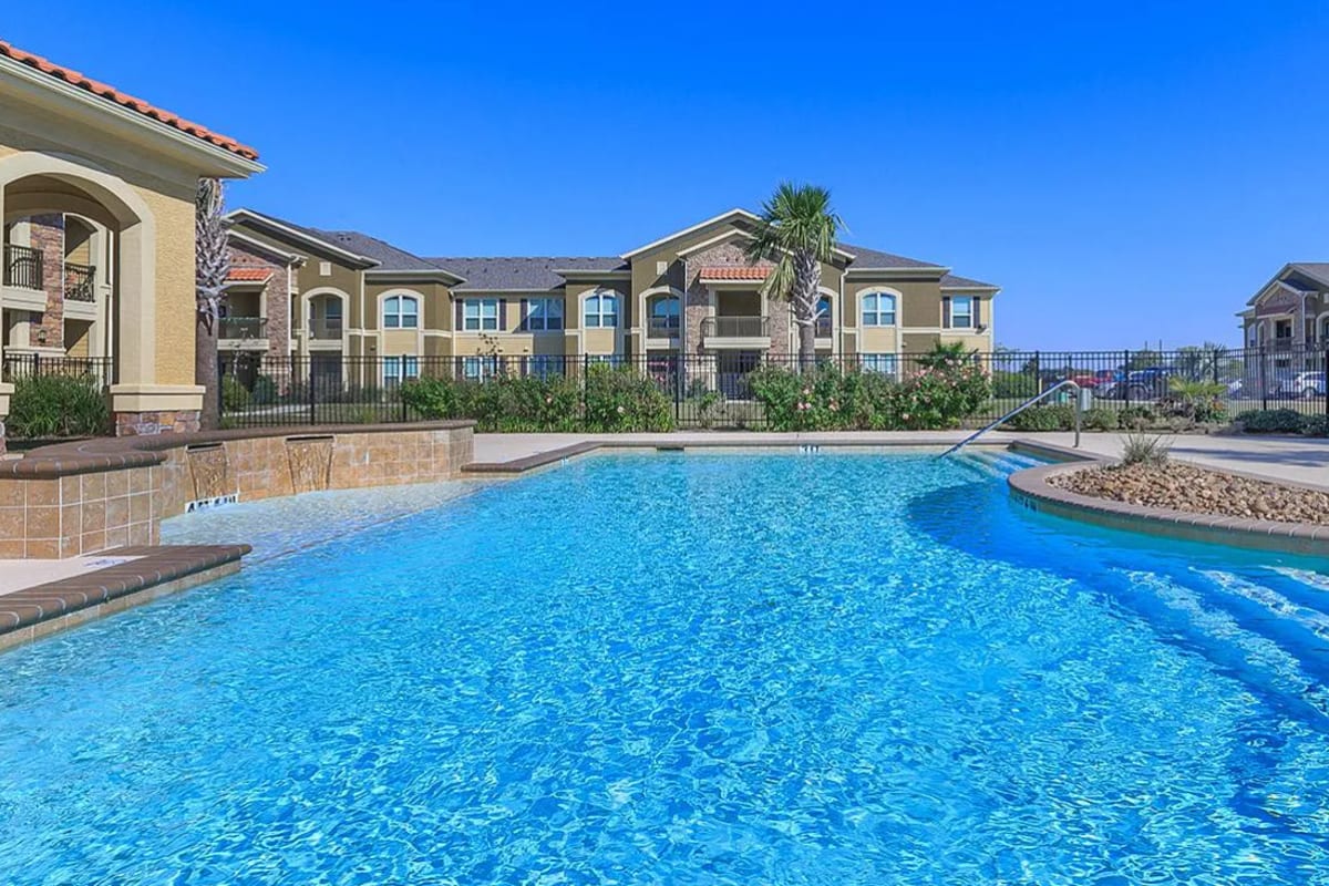 Sparkling pool at modern apartment community at Villas On Independence in Port Lavaca, Texas