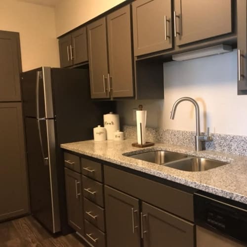 Apartment kitchen with modern finishes at Bristol Village in Bloomington, Minnesota