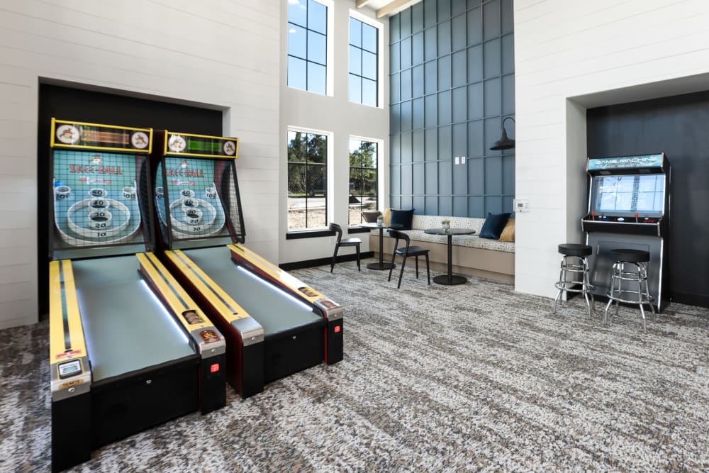 Game room with skee ball and arcade games at The Gabriel in Leander, Texas