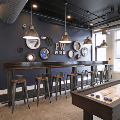 Firepit, outdoor lounge seating, and a gas grilling station at Park West 205 Apartment Homes in Pittsburgh, Pennsylvania