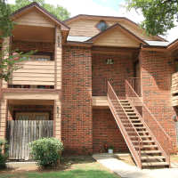 Exterior of the property with stairs for access at Stadium West Apartments in Arlington, Texas