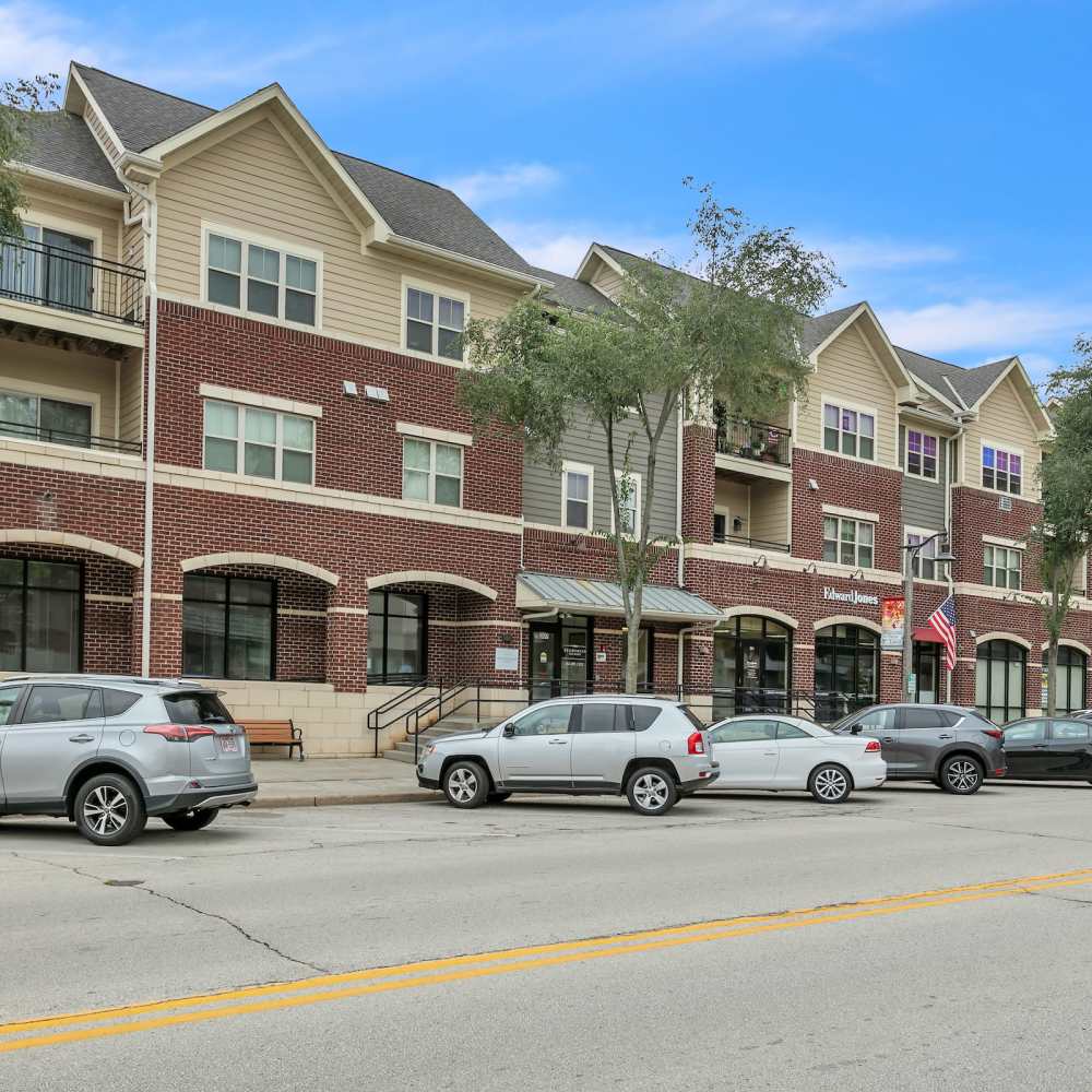Community apartment with car parked at Residences on Main in Twin Lakes, Wisconsin