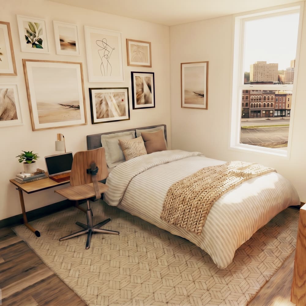 Cozy high rise bedroom with art and desk at City's Edge in Pittsburgh, Pennsylvania