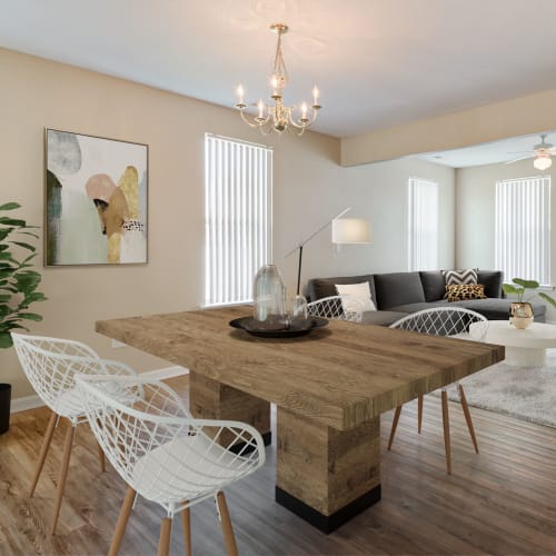 A furnished dining room and living room at The Village at Whitehurst Farm in Norfolk, Virginia