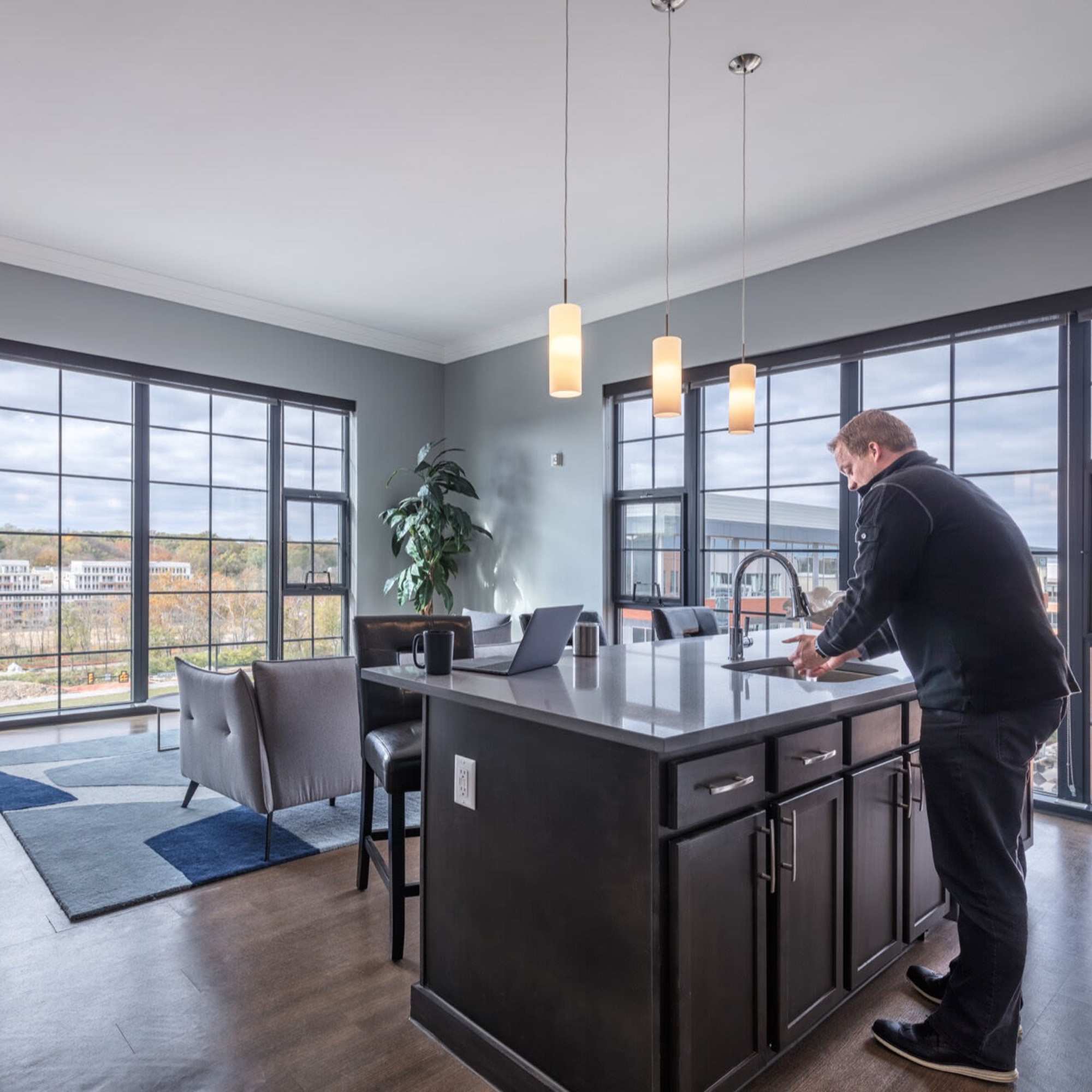 Modern kitchen with large windows and island at Bridge Park in Dublin, Ohio