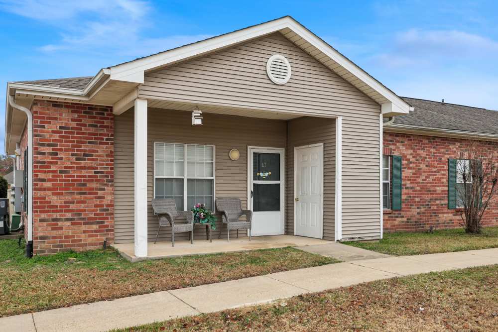 Exterior view of the community seating space and green lawn at Camden Park in Canton, Mississippi