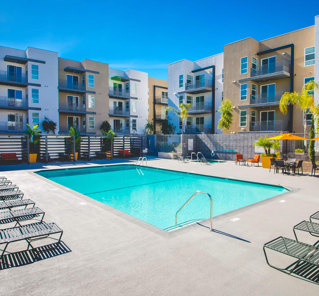 Swimming pool with resident buildings in background at IMT Sherman Circle in Van Nuys, California