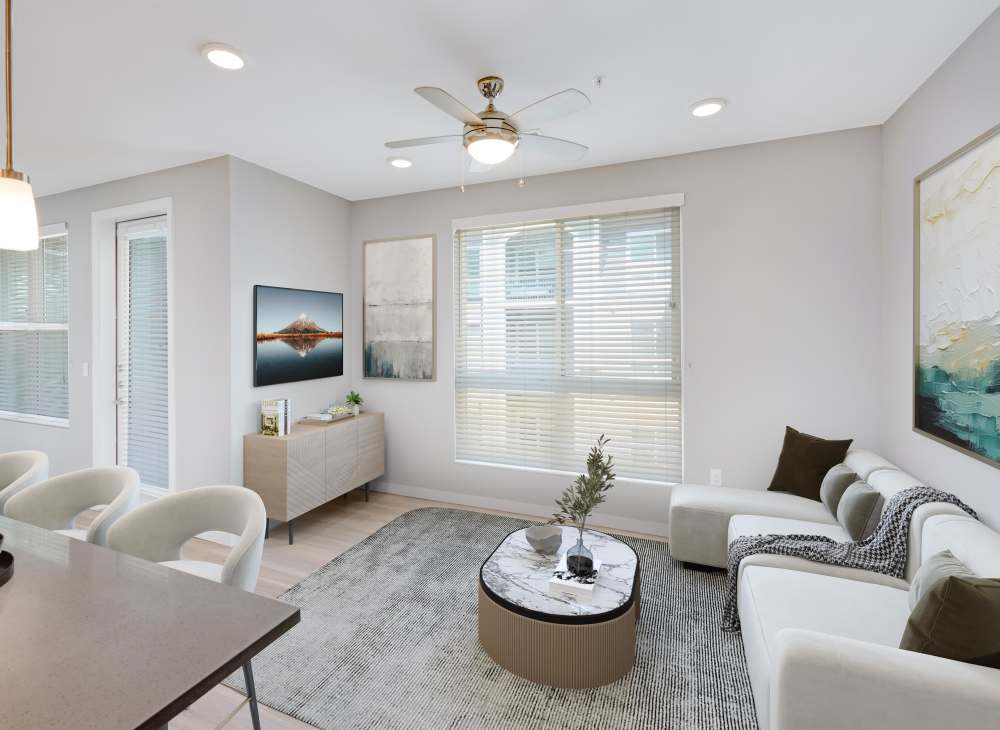 An spacious, open apartment living room at Hawthorne Hill Apartments in Thornton, Colorado