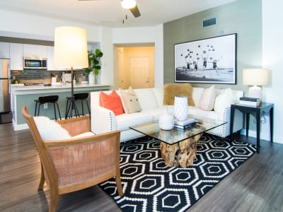 Model living room and kitchen at The Sophia at Abacoa in Jupiter, Florida