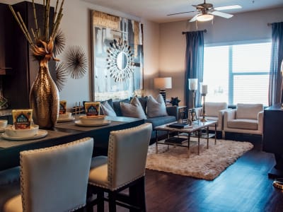 Living room of a model home with hardwood-style floors at Terra at University North Park in Norman, Oklahoma