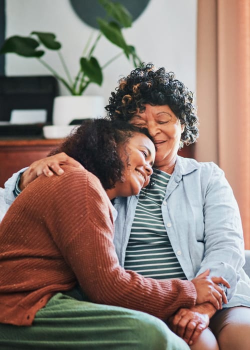 Elderly woman comforting her grandchild at The Pillars of Prospect Park in Minneapolis, Minnesota