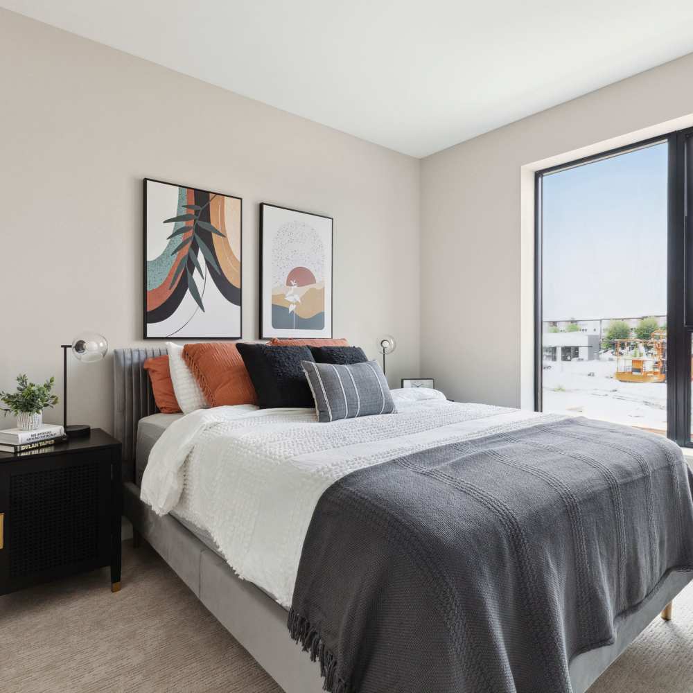 Bedroom with large window at Oaks Pentagon Village in Edina, Minnesota