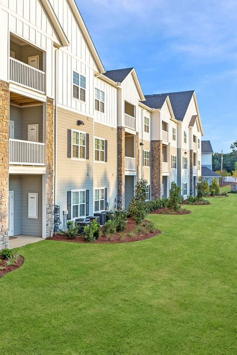 Exterior of Creekside at Greenlawn Apartment Homes on a sunny spring day in Columbia, South Carolina