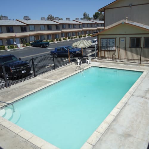 Aerial view of the swimming pool area at Olympus Court Apartments in Bakersfield, California