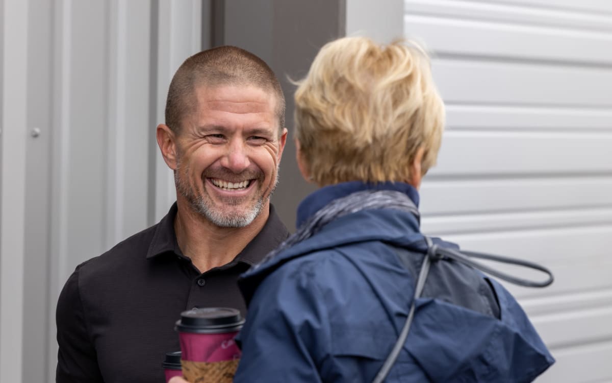 Two people outside a Luxe Locker (Single) storage unit