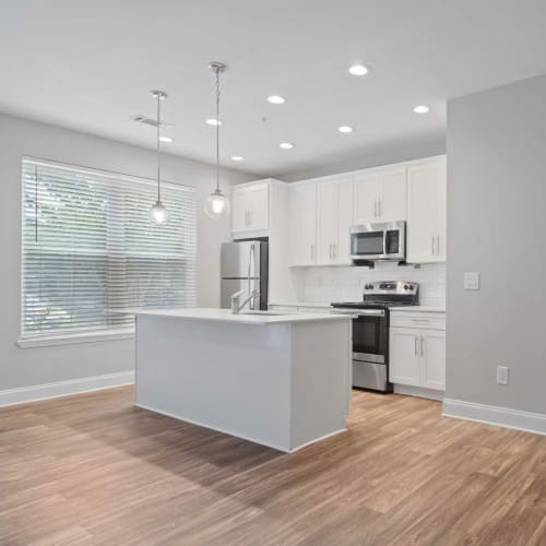 Apartment kitchen with an island at Mirador at Peachtree in Atlanta, Georgia