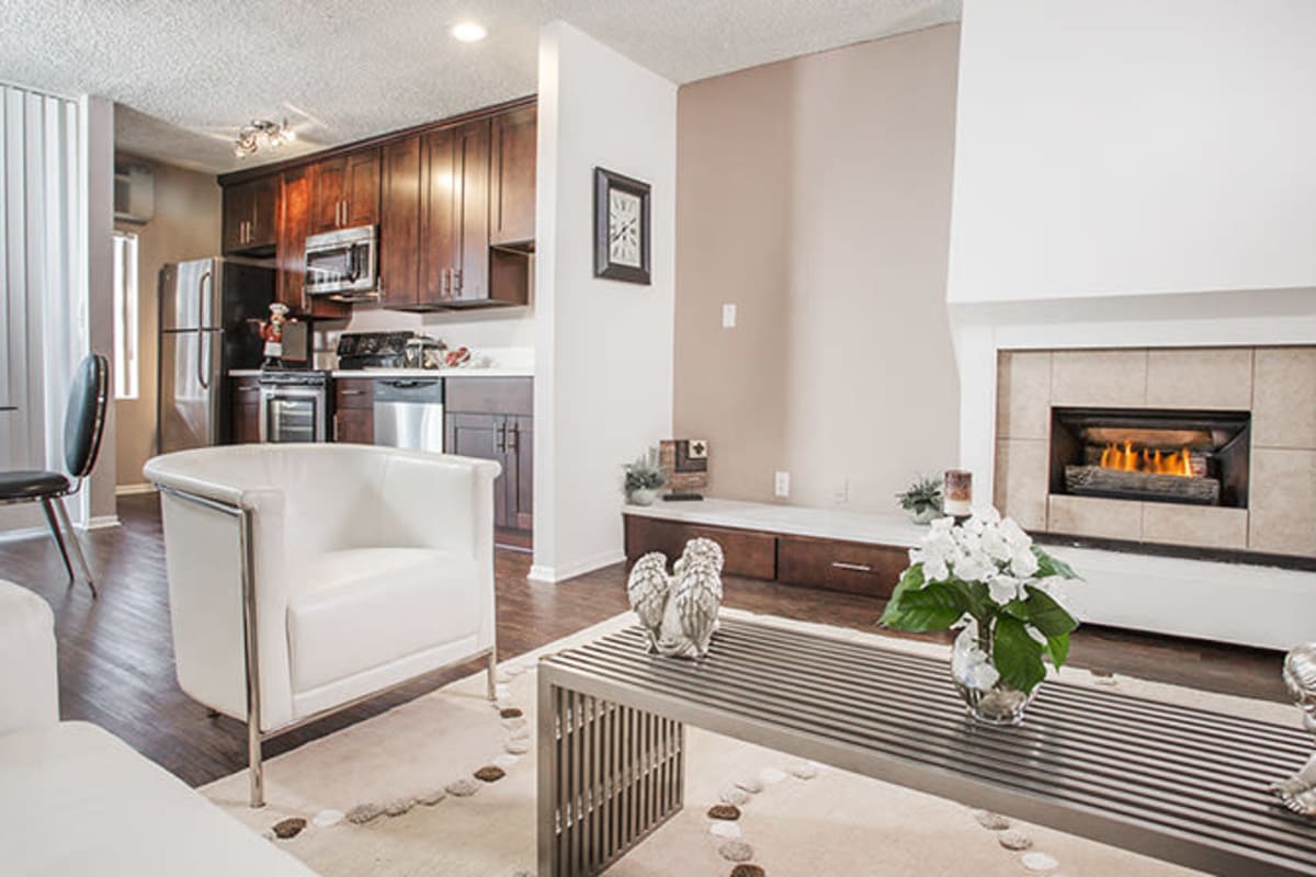 Apartment with fireplace and wood-style floors at Ascent, West Hollywood, California