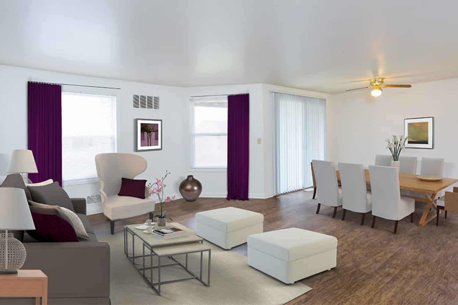 Model living room and dining room of an open layout home at Riverton Knolls in West Henrietta, New York