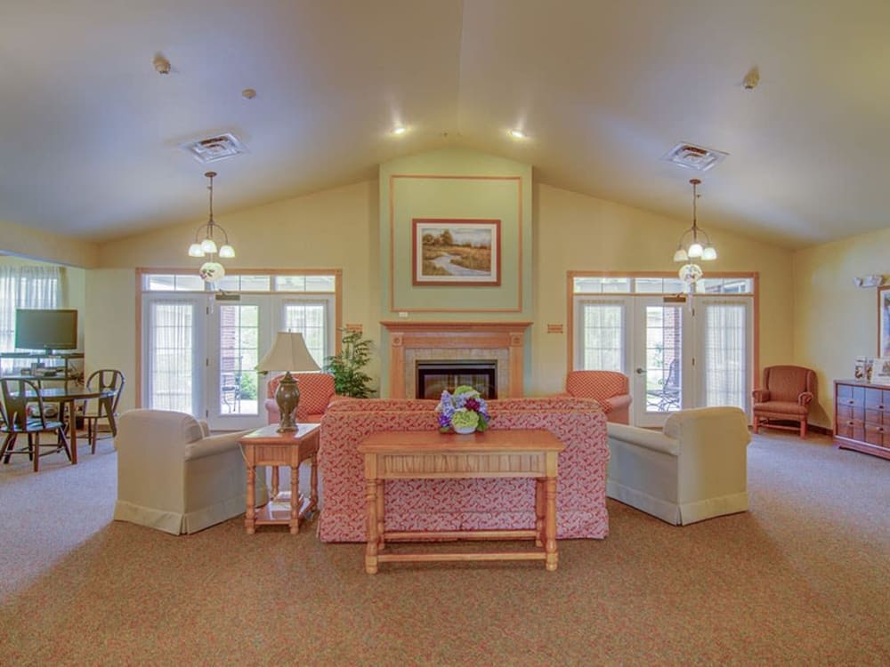 Resident community area with vaulted ceilings and large windows at Randall Residence of McHenry in McHenry, Illinois