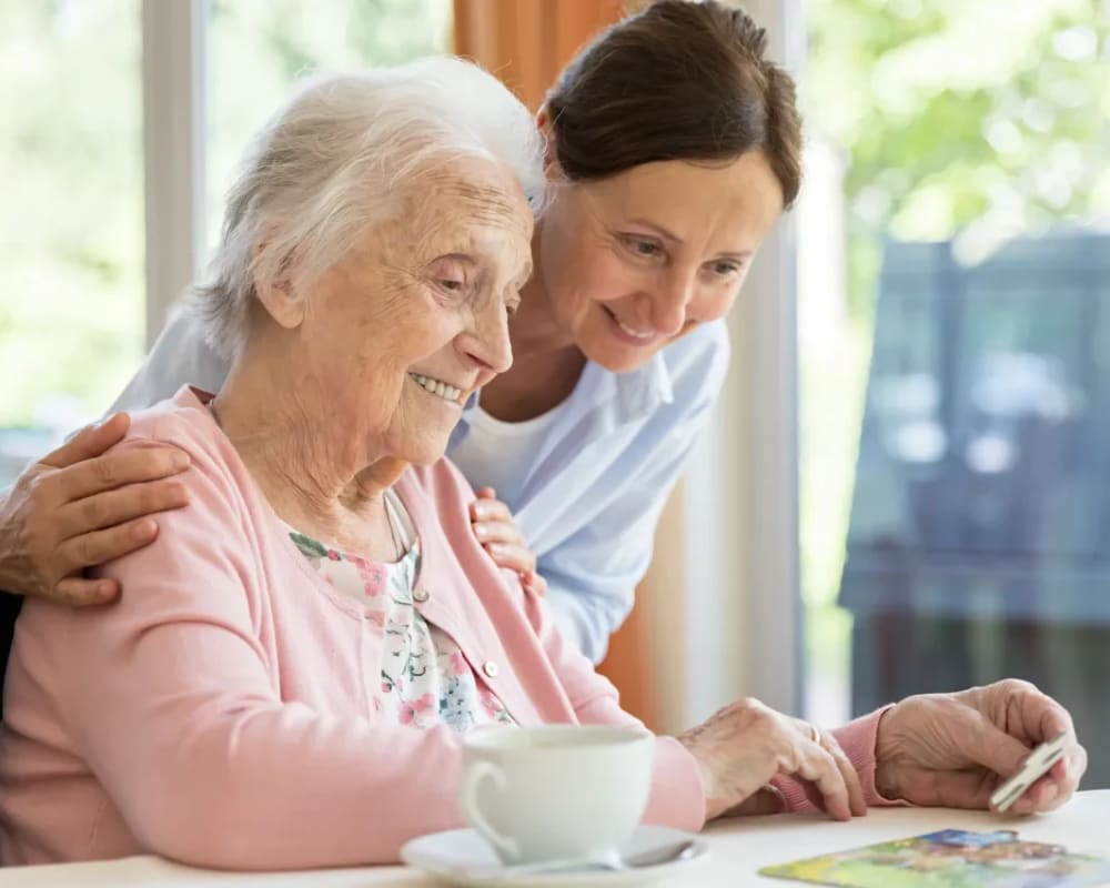 Residents work on a jigsaw puzzle at Milestone Senior Living in Faribault, Minnesota.