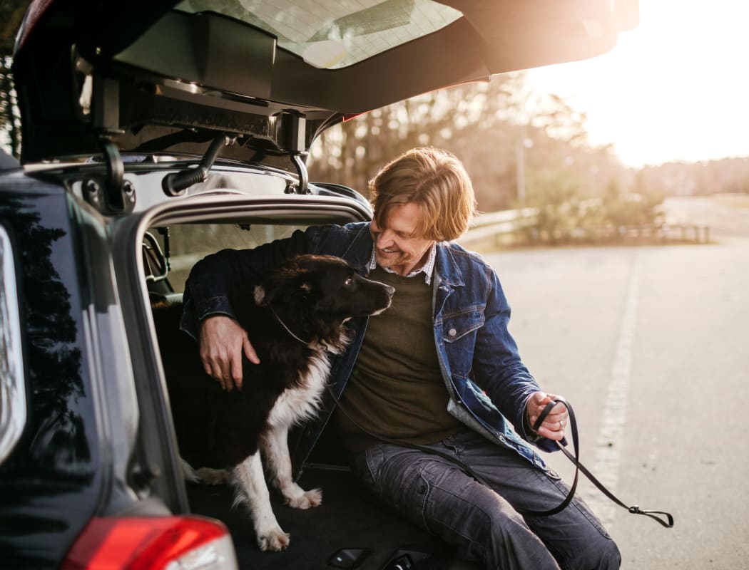 Man going to walk his dog in Broken Arrow, Oklahoma near Scissortail Crossing Apartments
