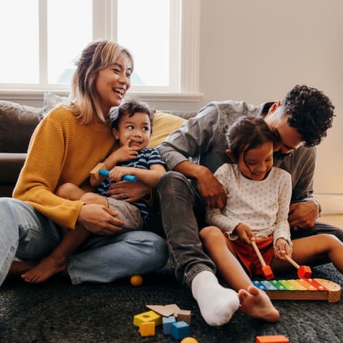 Family in their home at Midtown Manor and Towers in Bryan, Texas