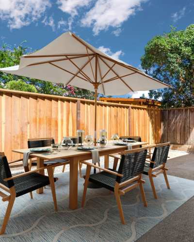 Patio with table and chairs at Pebble Creek Apartment Homes, Campbell, California
