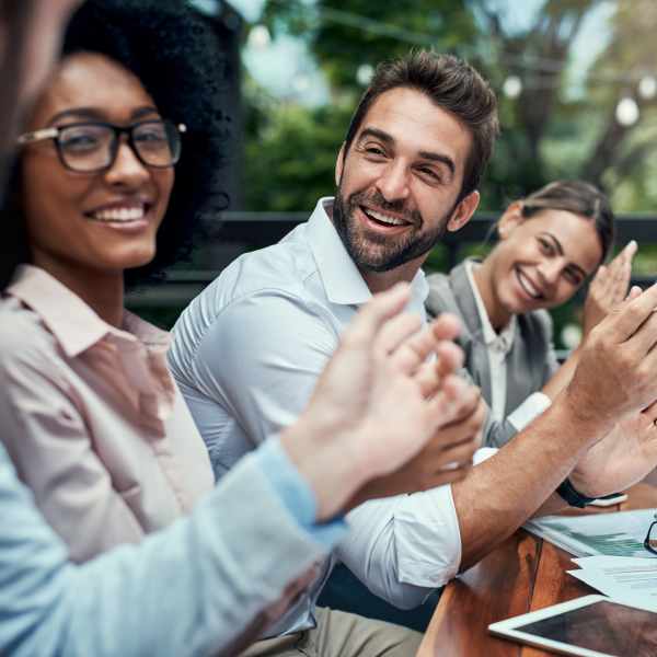 People talking in meeting at O'Brien Realty Group in Avon, Connecticut
