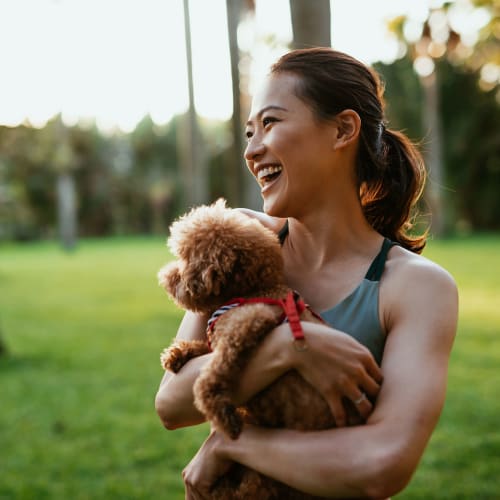 A lady and her pet at a dog park near Haven Hills in Vancouver, Washington