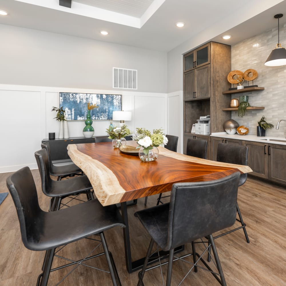 Communal wood slab table in the common area of Novo Kendall Town in Jacksonville, Florida