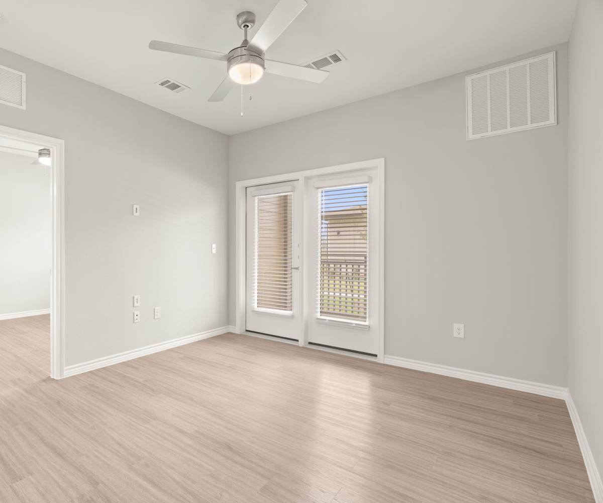 Open living area with windows at Walnut Springs in Seguin, Texas