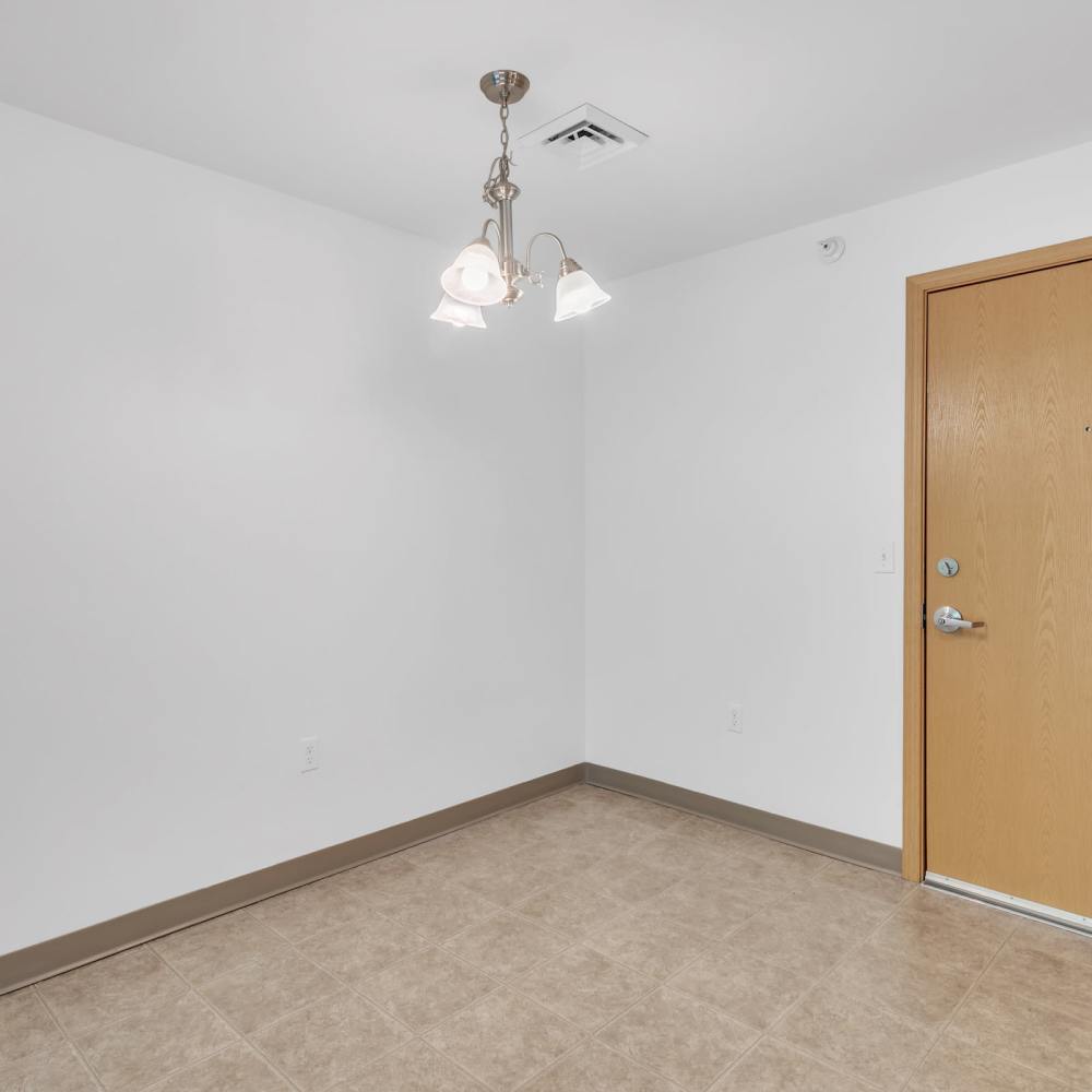 Unfurnished dining area with tile flooring at Residences on Main in Twin Lakes, Wisconsin