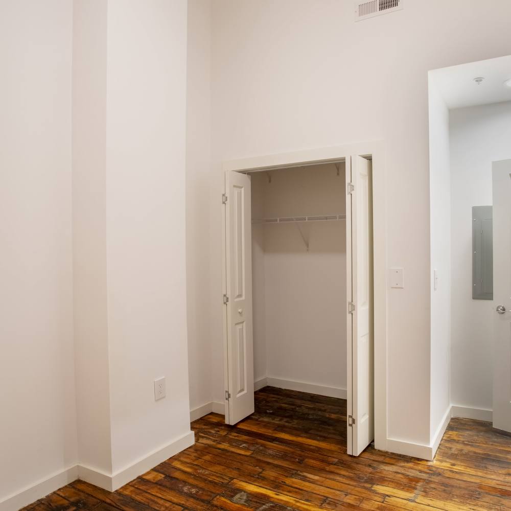 Bedroom with walk-in closets at Lofts at Inman Mills in Inman, South Carolina