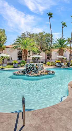 Resort‑style pool with water feature at Fairways on Green Valley in Henderson, Nevada