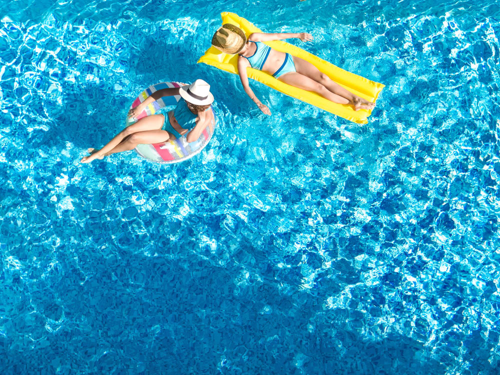 Two residents in the pool at TerraLane on Cotton in Surprise, Arizona