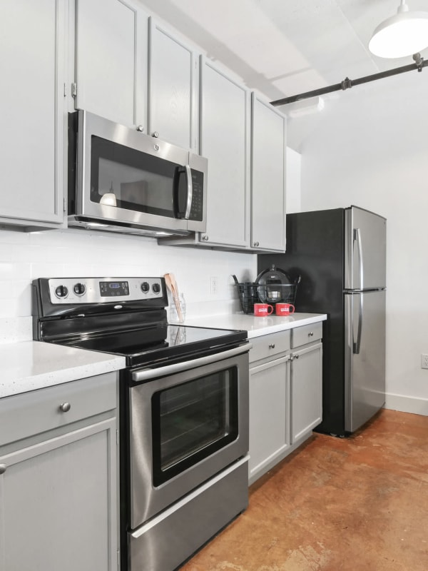 Kitchen with stainless-steel appliances at South Side on Lamar in Dallas, Texas