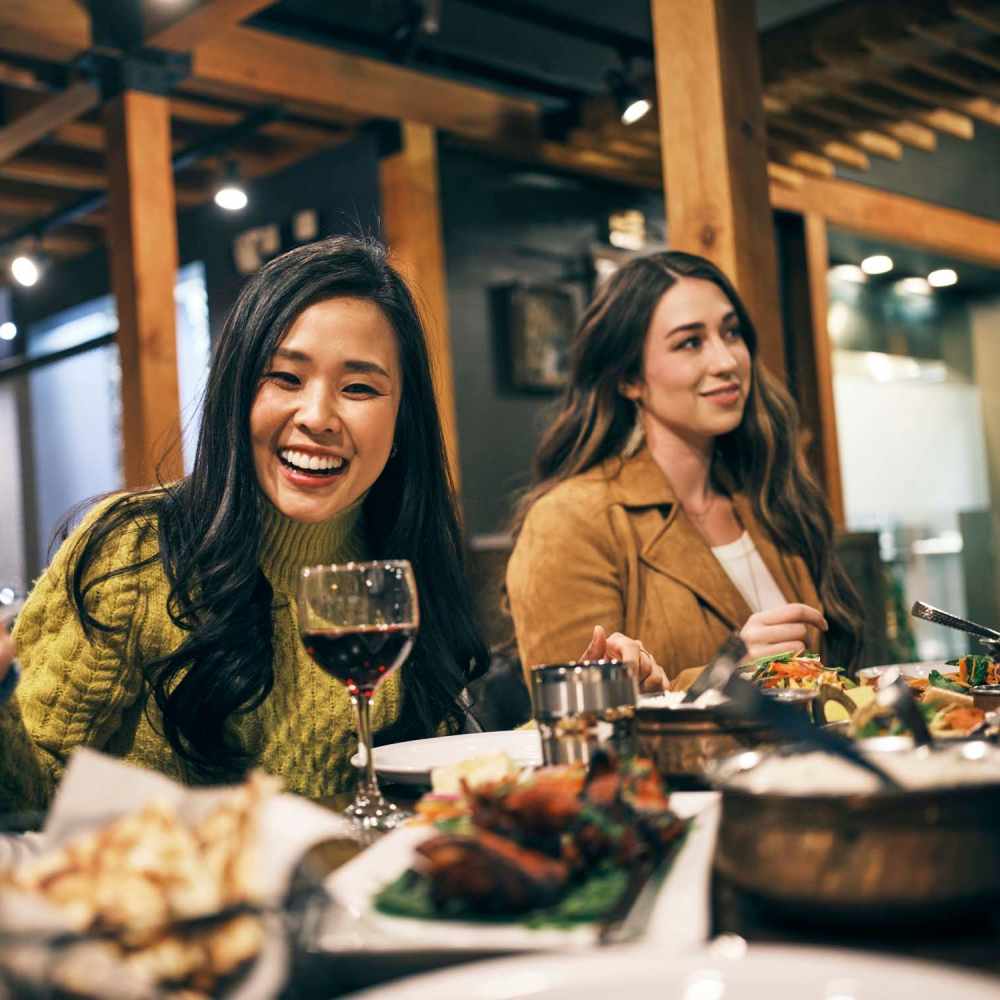 Friends at a chic dining venue at Loop Commons in Lafayette, Louisiana