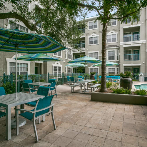 Patio with tables and chairs at The Maroneal, Houston, Texas