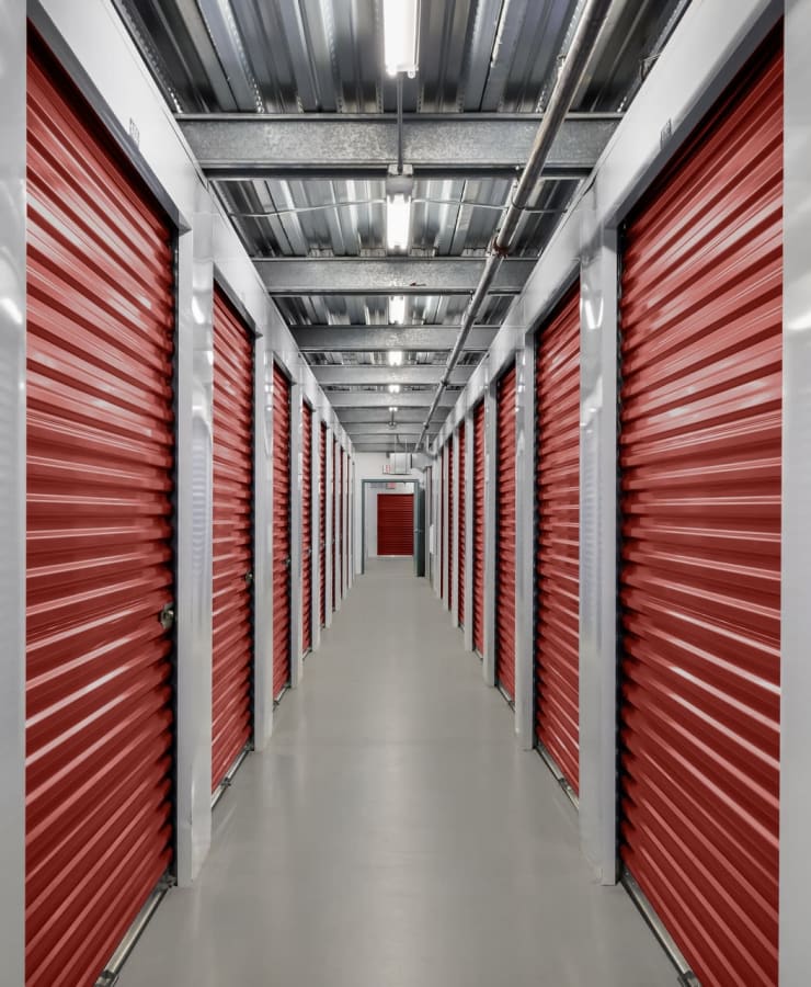 Indoor units with red doors at StorQuest Self Storage in Carlsbad, California