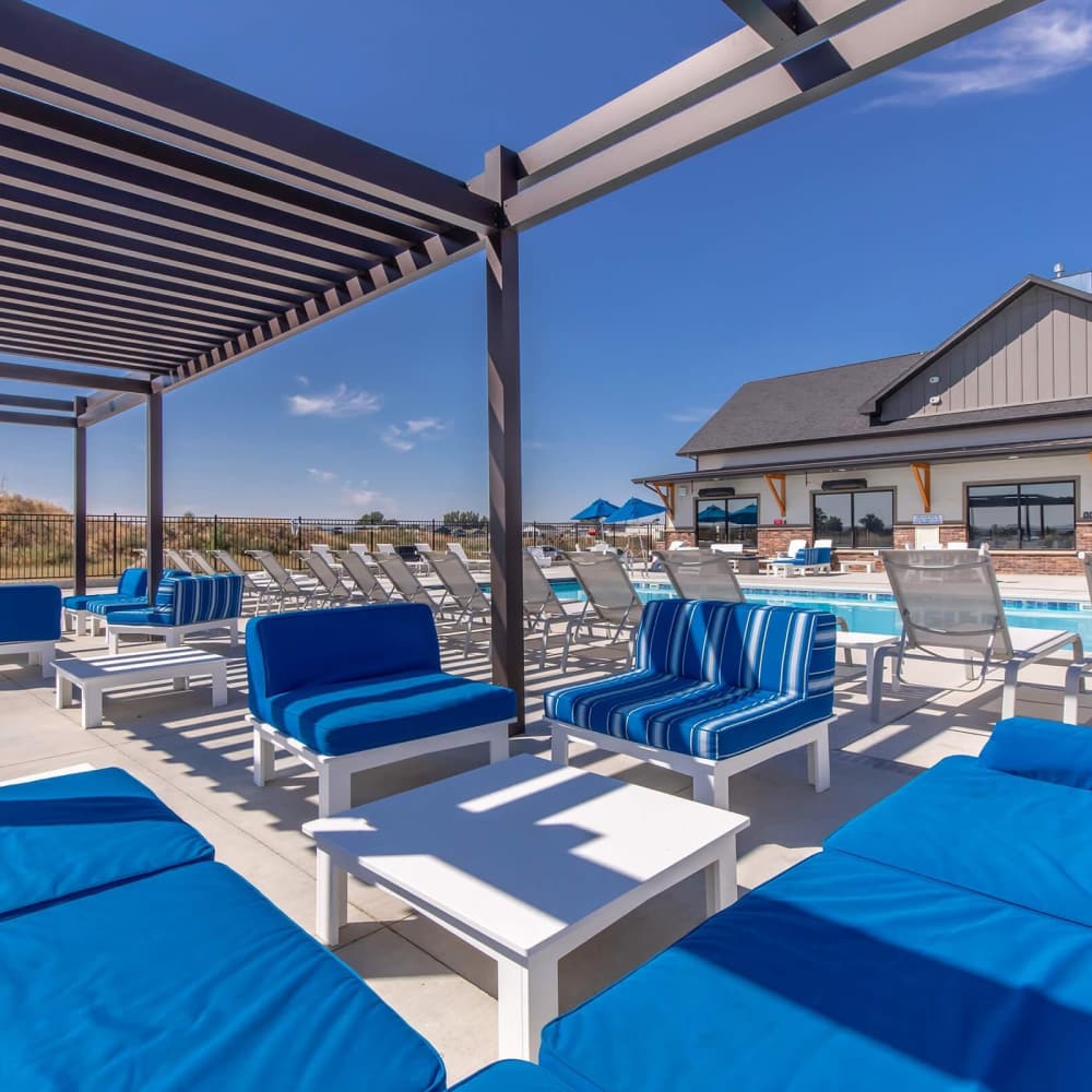 Outdoor lounge area near pool with seating at InterUrban 2.0 in Billings, Montana