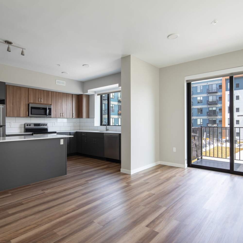 Unfurnished living room with access to private balcony at Oaks Pentagon Village in Edina, Minnesota