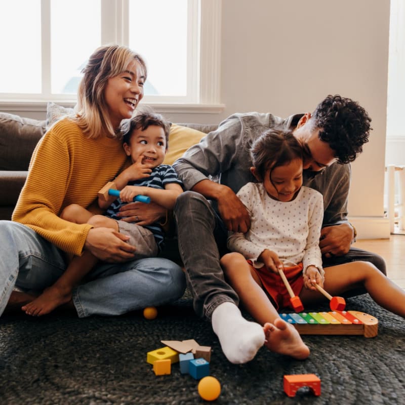 Happy family in their home at Royale in Westminster, California