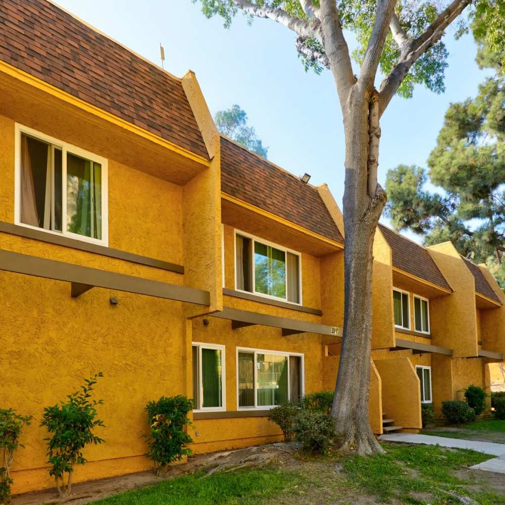 Community surrounded by trees at St. Andrews Gardens in Los Angeles, California