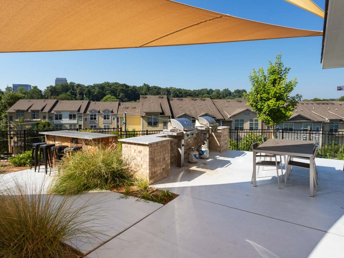 Grill station with seating and modern landscaping at Ardmore & Twenty Eighth in Atlanta, Georgia