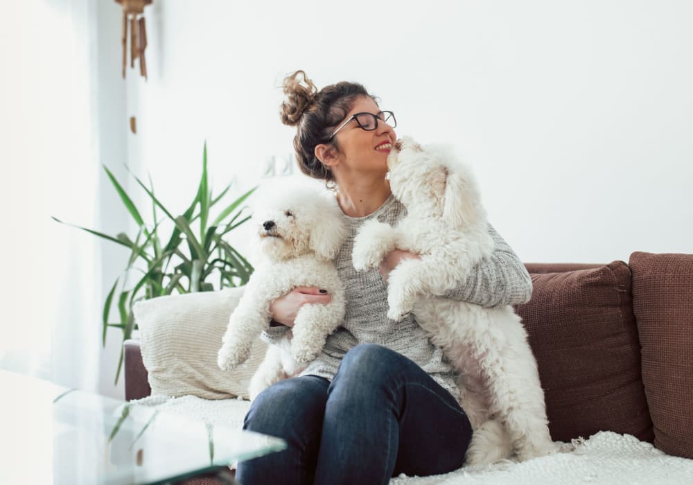 Resident holding her dog at Division Terrace in Portland, Oregon